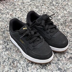 Puma Black Sneakers with Gold Accents